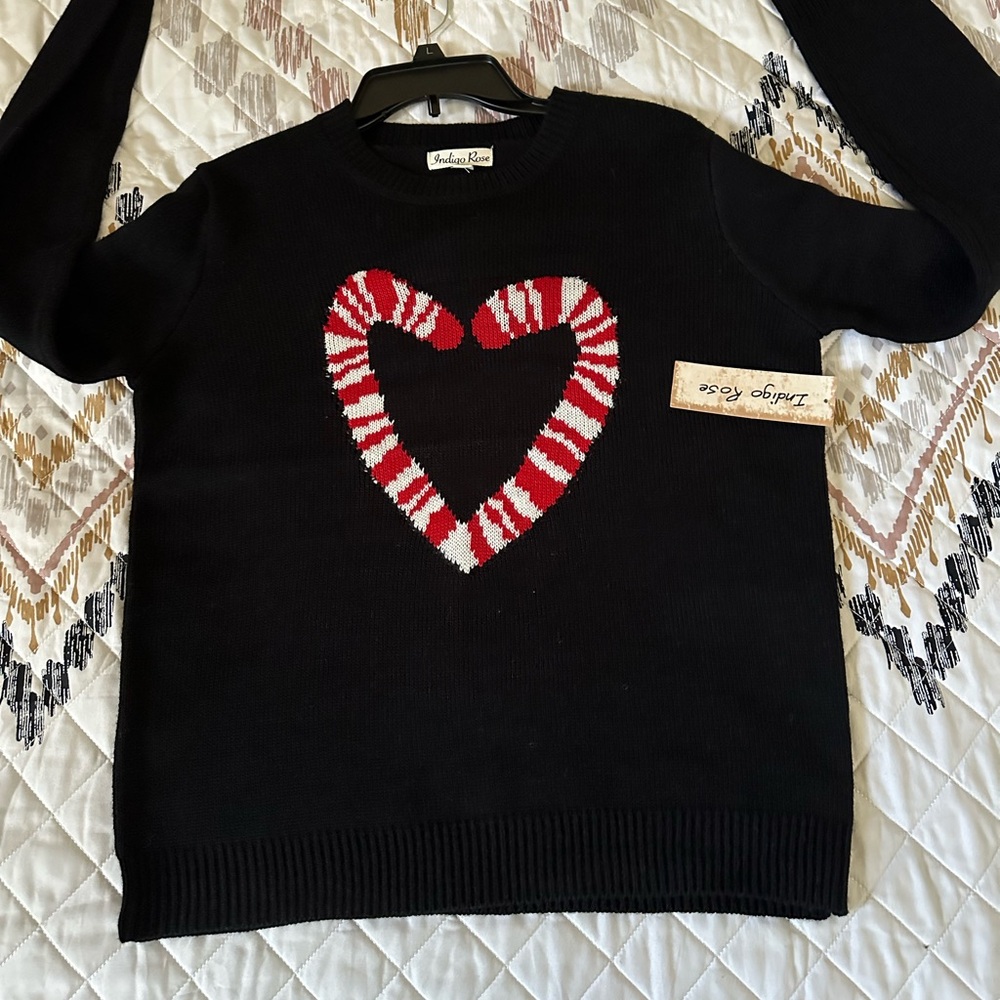 Indigo rose Black Sweater with‎ 2 candy canes logo. Size Large. NWT.